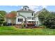 Landscaped backyard showing the deck, lawn and seating, offering a relaxing outdoor space at 1214 Foxfield Rd, Waxhaw, NC 28173