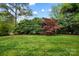 Large green lawn with mature landscaping provide privacy and a beautiful natural backdrop at 1214 Foxfield Rd, Waxhaw, NC 28173
