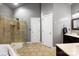 Spacious bathroom featuring a glass-enclosed shower, tiled flooring, and a double vanity for added convenience at 1214 Foxfield Rd, Waxhaw, NC 28173