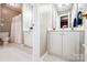 Simple bathroom with a white vanity, toilet, and shower with curtain, showcasing a clean and functional space at 1214 Foxfield Rd, Waxhaw, NC 28173