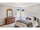 Cozy bedroom with natural light, neutral walls, and a well-placed dresser for storage at 1214 Foxfield Rd, Waxhaw, NC 28173