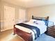 Comfortable bedroom with a wooden bed frame and neutral wall paint at 1214 Foxfield Rd, Waxhaw, NC 28173