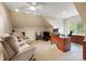 Spacious bonus room offers flexible living space with neutral carpet, recliner chairs, and a large office desk at 1214 Foxfield Rd, Waxhaw, NC 28173