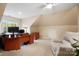 Well-lit bonus room with a desk, comfortable seating, and natural light, perfect for a home office or study at 1214 Foxfield Rd, Waxhaw, NC 28173