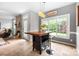 Breakfast area features bar-height table with seating and view into living room with fireplace at 1214 Foxfield Rd, Waxhaw, NC 28173