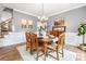 Dining room with classic decor, wood furnishings, and view into adjoining rooms at 1214 Foxfield Rd, Waxhaw, NC 28173