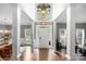 Grand foyer with soaring ceilings, elegant chandelier, and beautiful hardwood floors at 1214 Foxfield Rd, Waxhaw, NC 28173