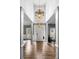 Impressive foyer featuring a high ceiling, elegant chandelier, and a clear view of the home's interior at 1214 Foxfield Rd, Waxhaw, NC 28173