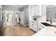 Bright kitchen featuring white cabinetry, stainless steel appliances, and a view into the adjacent dining room at 1214 Foxfield Rd, Waxhaw, NC 28173