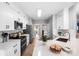 Modern kitchen featuring white cabinets, stainless steel appliances, and a bright, functional design at 1214 Foxfield Rd, Waxhaw, NC 28173