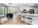 Charming kitchen boasts a breakfast bar with seating, pendant lighting, and ample natural light from the large window at 1214 Foxfield Rd, Waxhaw, NC 28173