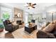 Comfortable living space with fireplace, leather furniture, and seamless access to the kitchen and dining area at 1214 Foxfield Rd, Waxhaw, NC 28173
