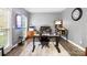 Spacious home office with a modern desk setup, ample lighting, and a relaxed and productive atmosphere at 1214 Foxfield Rd, Waxhaw, NC 28173