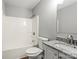 This bathroom features a granite countertop, white cabinets, and a shower-tub combo at 1320 Beaconfield Ct, Rock Hill, SC 29730