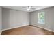Bedroom features a window offering view and a modern ceiling fan at 1320 Beaconfield Ct, Rock Hill, SC 29730