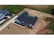 Aerial view of new construction home with a black roof and white siding at 1429 Coppergate Dr, Salisbury, NC 28147