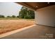 A covered patio offers an open view of the expansive backyard, perfect for outdoor gatherings and relaxation at 1429 Coppergate Dr, Salisbury, NC 28147