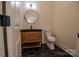 Charming powder room featuring a modern vanity, sleek fixtures, and hexagon tile floor at 1429 Coppergate Dr, Salisbury, NC 28147