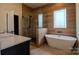 The primary bathroom features a soaking tub, glass shower, and tiled walls at 1429 Coppergate Dr, Salisbury, NC 28147