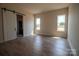 Spacious bedroom with natural light, wood floors, and a barn door to the bathroom at 1429 Coppergate Dr, Salisbury, NC 28147