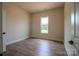 A light and airy bedroom with a large window and neutral color palette, creating a serene atmosphere at 1429 Coppergate Dr, Salisbury, NC 28147