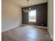 Bright dining room features modern lighting, a large window, and neutral walls at 1429 Coppergate Dr, Salisbury, NC 28147