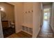 Hallway features storage cubbies and access to the bathroom and the home's entrance at 1429 Coppergate Dr, Salisbury, NC 28147