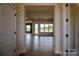 Bright and airy living room with expansive windows and sleek wood flooring, offering a modern and inviting space at 1429 Coppergate Dr, Salisbury, NC 28147