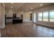 Open-concept living room with a view of the kitchen, featuring light wood floors and plenty of natural light at 1429 Coppergate Dr, Salisbury, NC 28147