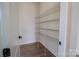 Bright pantry featuring wire shelving and wood-look floors providing storage at 1429 Coppergate Dr, Salisbury, NC 28147