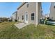 Backyard of the home with small patio area and grass at 14328 Evening Flight Ln, Charlotte, NC 28262