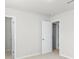 Bright bedroom has neutral carpeting and classic doors at 14328 Evening Flight Ln, Charlotte, NC 28262