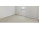 Bright bedroom features neutral carpeting and a single window at 14328 Evening Flight Ln, Charlotte, NC 28262