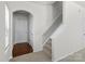 Welcoming entryway with hardwood floors, arched doorway, and staircase leading to the upper level at 14328 Evening Flight Ln, Charlotte, NC 28262