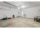 Bright garage has epoxy flooring and work area at 14328 Evening Flight Ln, Charlotte, NC 28262