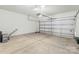 Spacious garage with bright lighting and an automated door at 14328 Evening Flight Ln, Charlotte, NC 28262