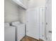 Convenient laundry room with washer, dryer, and storage shelves at 14328 Evening Flight Ln, Charlotte, NC 28262