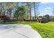 Spacious backyard featuring a large concrete patio area, a storage shed and a wooden fence at 14827 Smith Rd, Charlotte, NC 28273
