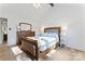 Bright bedroom featuring a vaulted ceiling and beautiful wood floors at 14827 Smith Rd, Charlotte, NC 28273
