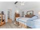 Spacious bedroom with wood floors, vaulted ceiling, and a view into the bathroom at 14827 Smith Rd, Charlotte, NC 28273