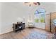 Bedroom showcasing a ceiling fan, window, and desk area at 14827 Smith Rd, Charlotte, NC 28273