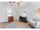 Bedroom features a desk, chair, and armchair with a large patterned rug at 14827 Smith Rd, Charlotte, NC 28273