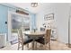 Cozy dining area with a round table, stylish chairs, and access to the backyard at 14827 Smith Rd, Charlotte, NC 28273