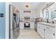 Charming kitchen with stainless steel appliances, white cabinets, and stylish countertops at 14827 Smith Rd, Charlotte, NC 28273