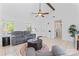 Inviting living room with vaulted ceiling, comfortable seating, and a bright, airy feel at 14827 Smith Rd, Charlotte, NC 28273