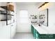 Stylish bathroom with green vanity, decorative tile floor, and contemporary fixtures at 14911 Barnsbury Dr, Huntersville, NC 28078