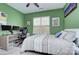 Bright bedroom with an ample desk space perfect for a home office and a large window allowing natural light at 14911 Barnsbury Dr, Huntersville, NC 28078