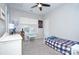 Bright bedroom featuring a ceiling fan, neutral carpet and decor, and ample natural light at 14911 Barnsbury Dr, Huntersville, NC 28078