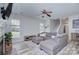 Inviting living room with a cozy sectional sofa, fireplace, and abundant natural light at 14911 Barnsbury Dr, Huntersville, NC 28078