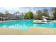Resort style pool with a slide, ample deck space, and a comfortable lounging area, perfect for summer days at 14911 Barnsbury Dr, Huntersville, NC 28078